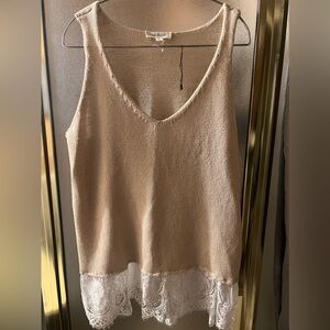 Tank top type sweater with lace bottom.